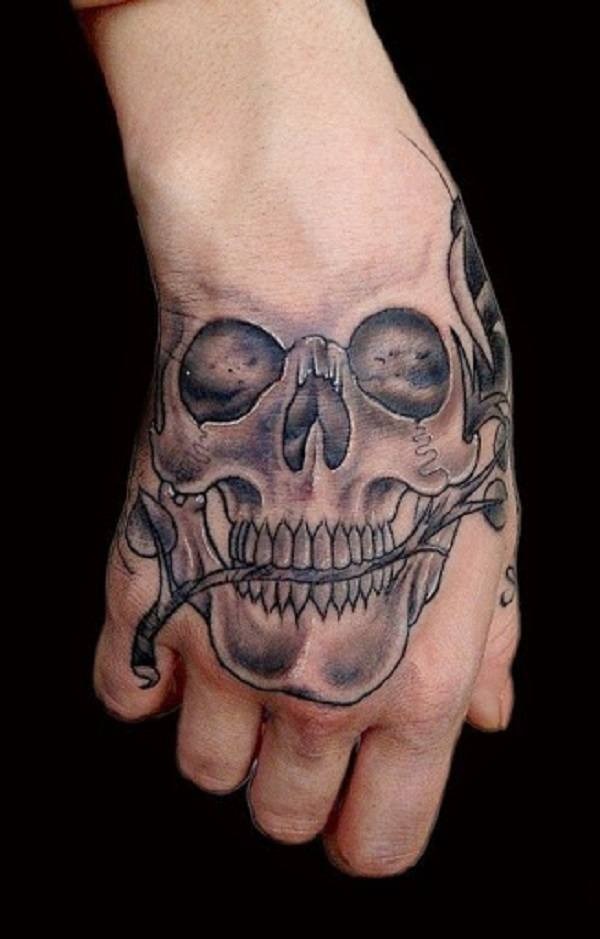 Romantic skull tattoo with a rose in its teeth on a hand Tattoo Design