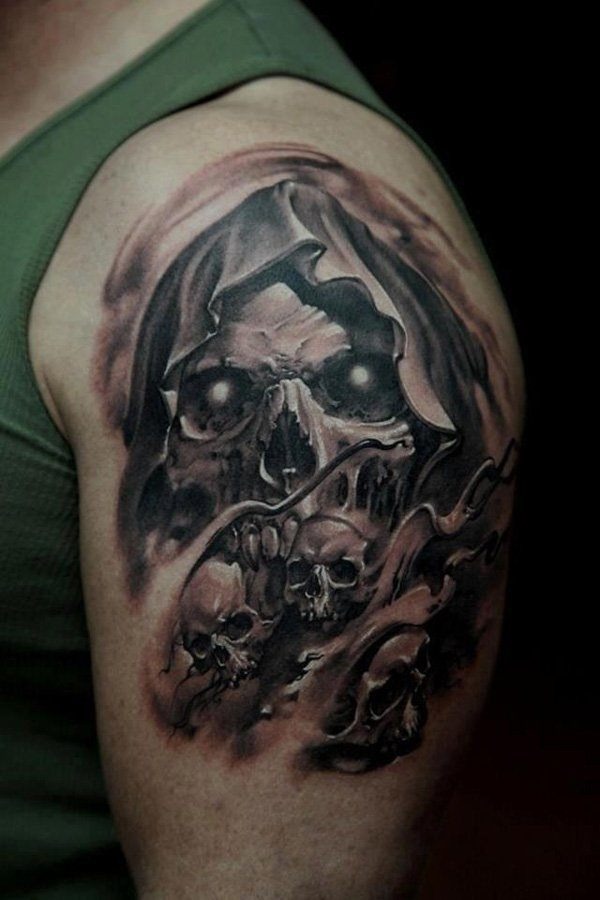 Skull tattoo on upper arm Tattoo Design
