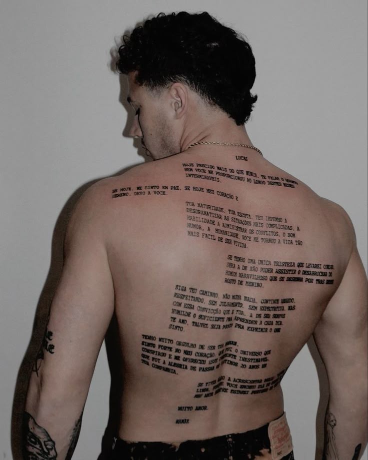 For those who have too much to say for a single quote, this full-back typewriter-style tattoo layers blocks of text in a literary collage.