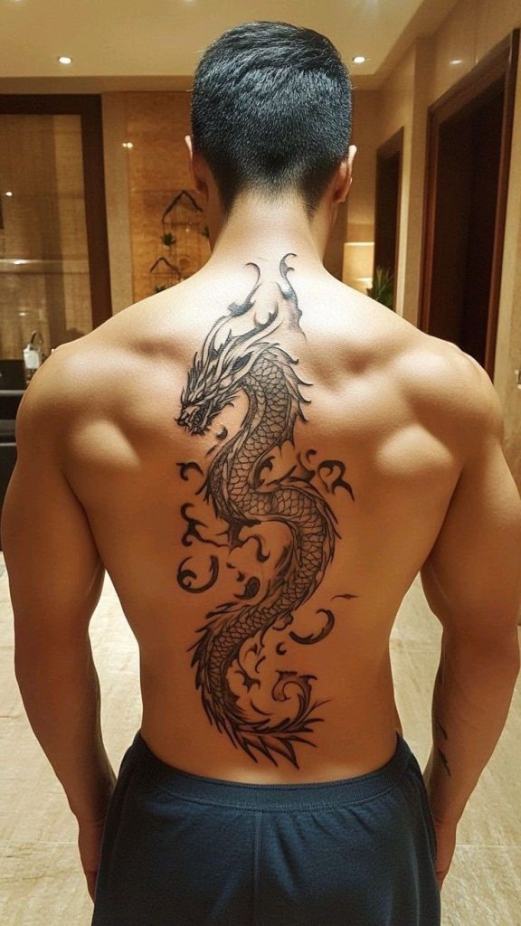 There's something undeniably powerful about a dragon tattoo, and this full-back design coils down the spine with mythical intensity.