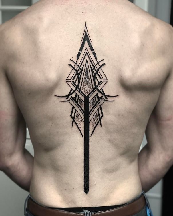 Geometric and architectural, this spine tattoo feels like futuristic armor.