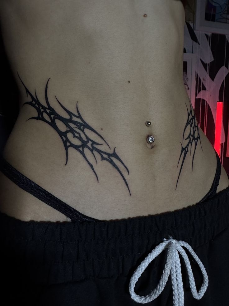 Minimal Symmetrical Tribal Lower Belly Spikes Tattoo Design