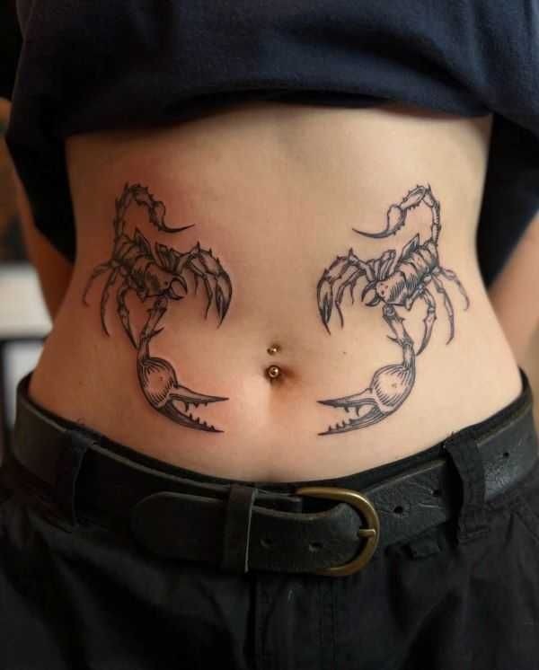 Symmetrical Scorpions on the Man’s Lower Stomach Tattoo Design