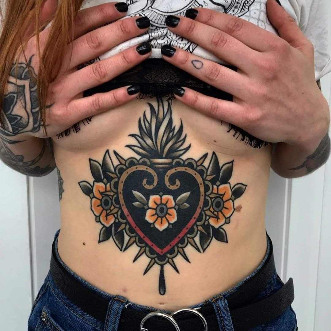 Traditional Flaming Heart With Flowers Tattoo Design