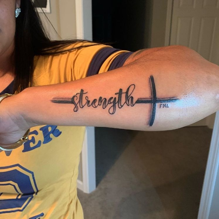Bold Cross and Strong Forearm Statement, a tattoo design rendered in bold.