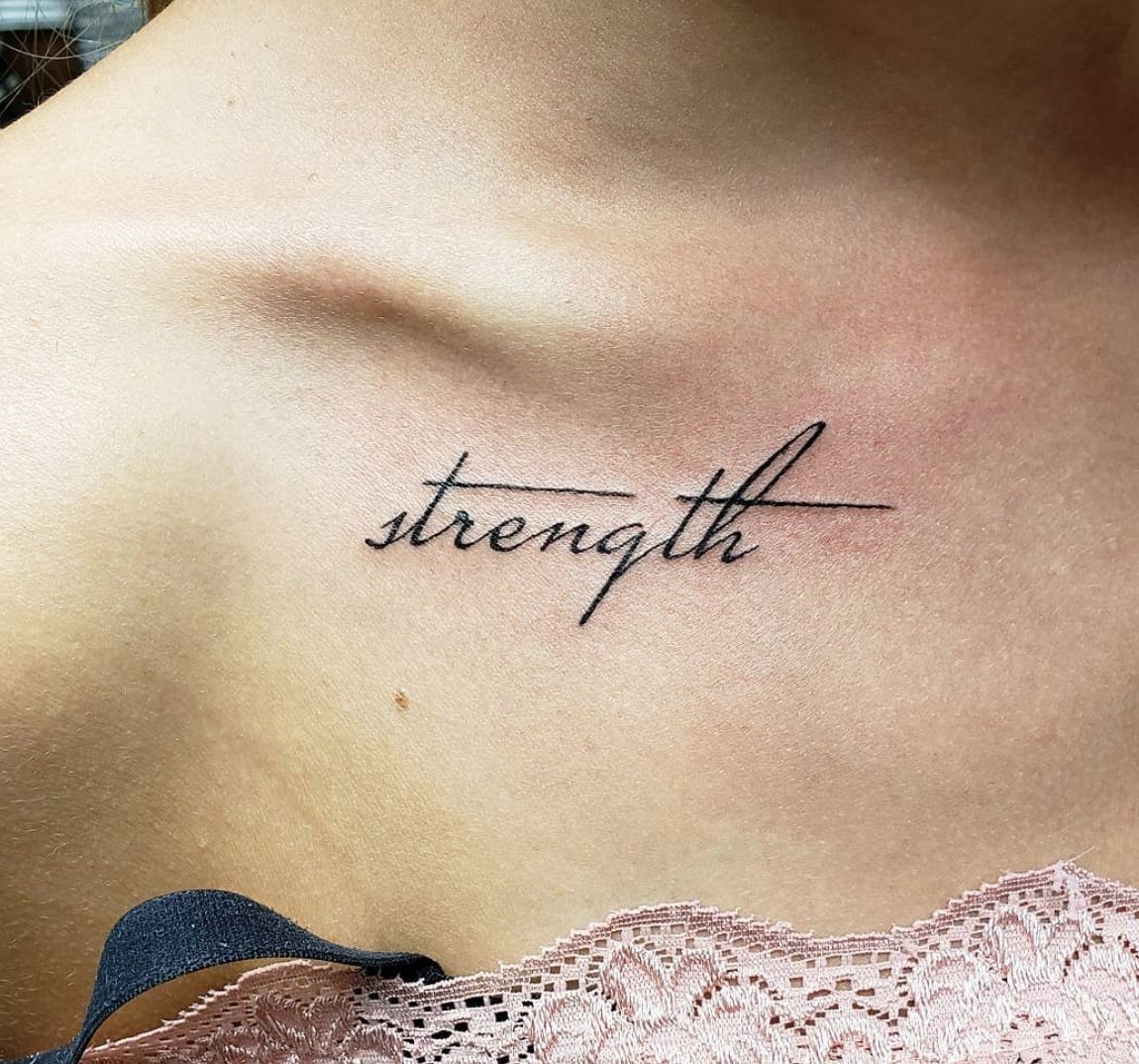 Minimalist Collarbone Strength Tattoo, a tattoo design rendered in delicate fine-line for the leg.