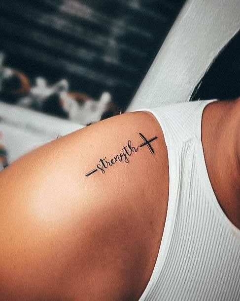 Shoulder Strength Cross Script Tattoo, a tattoo design rendered in clean detailed linework.