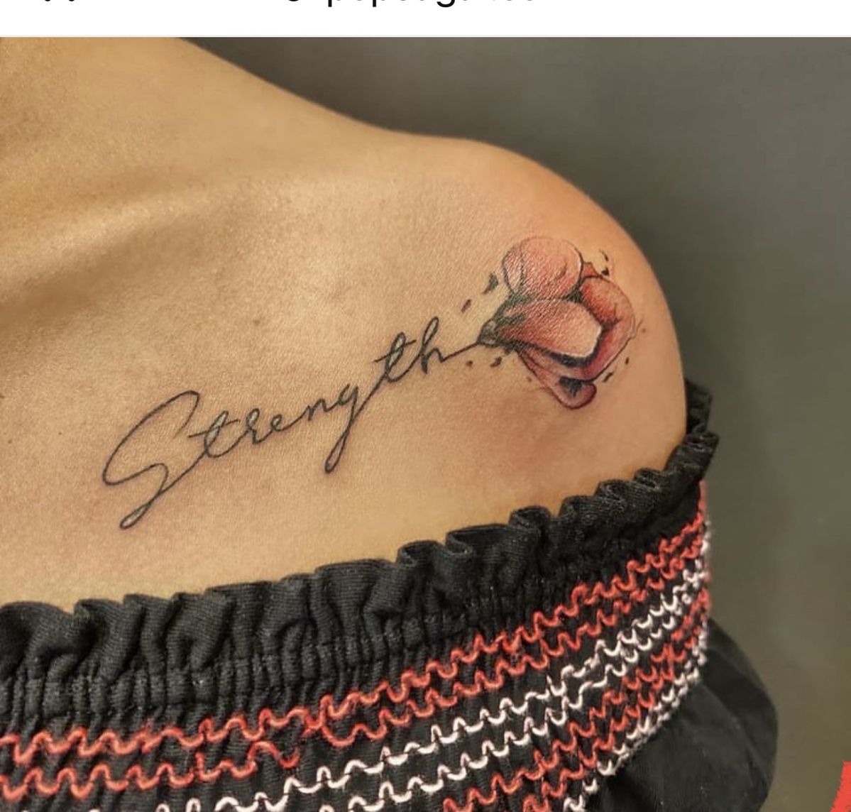 Shoulder Strength Flower Tattoo, a tattoo design rendered in delicate fine-line.