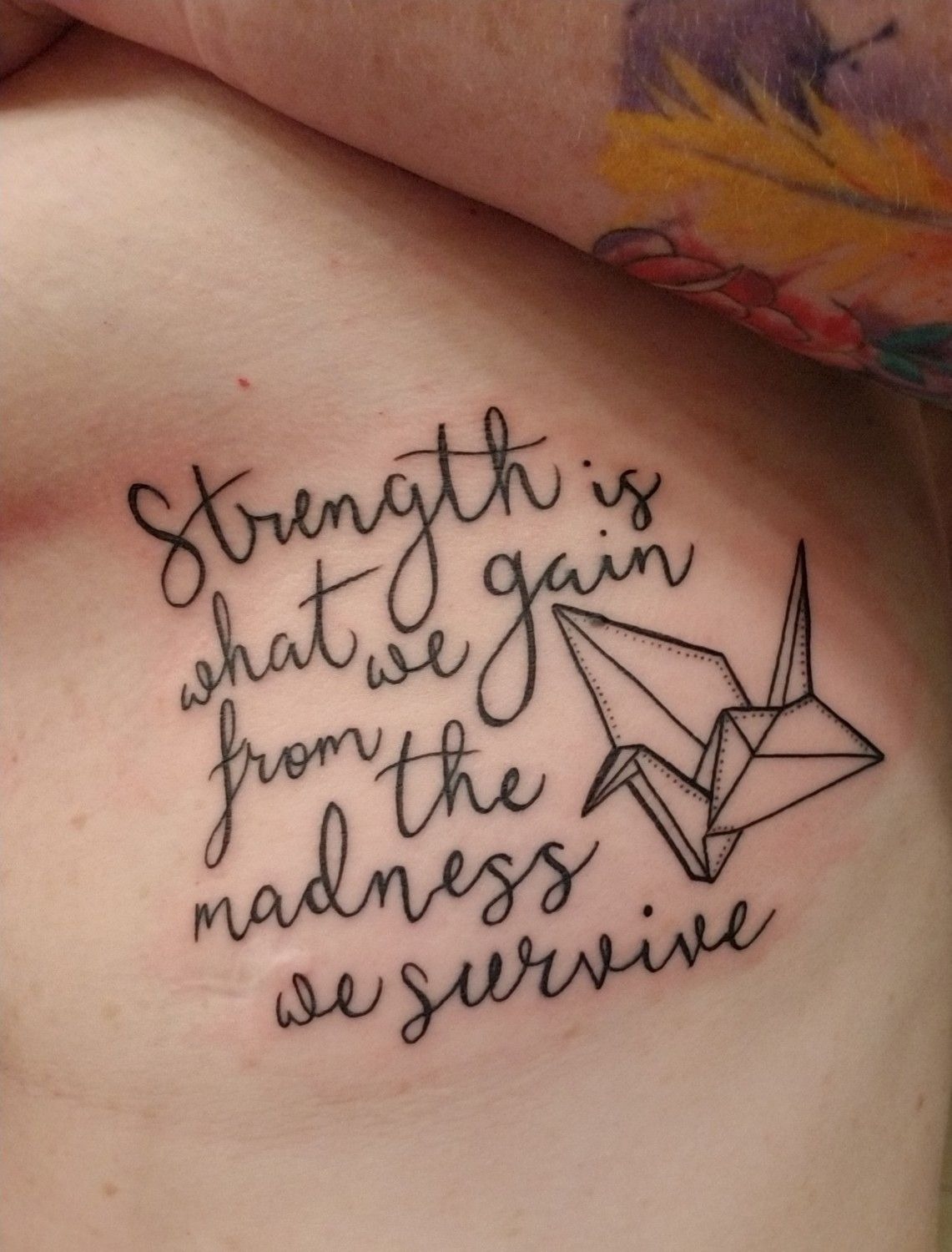 Strength Quote With Origami Crane, a tattoo design rendered in delicate fine-line.