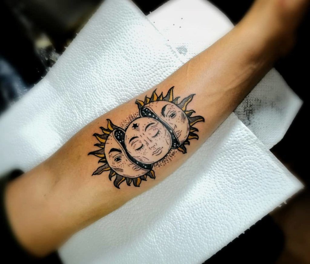 Masked Sun and Moon Tattoo for the Depiction of Phases of Life Tattoo Design
