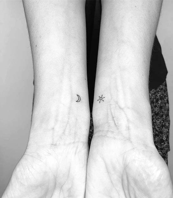 Simplistically Small Sun and Moon Wrist Ink Tattoo Design