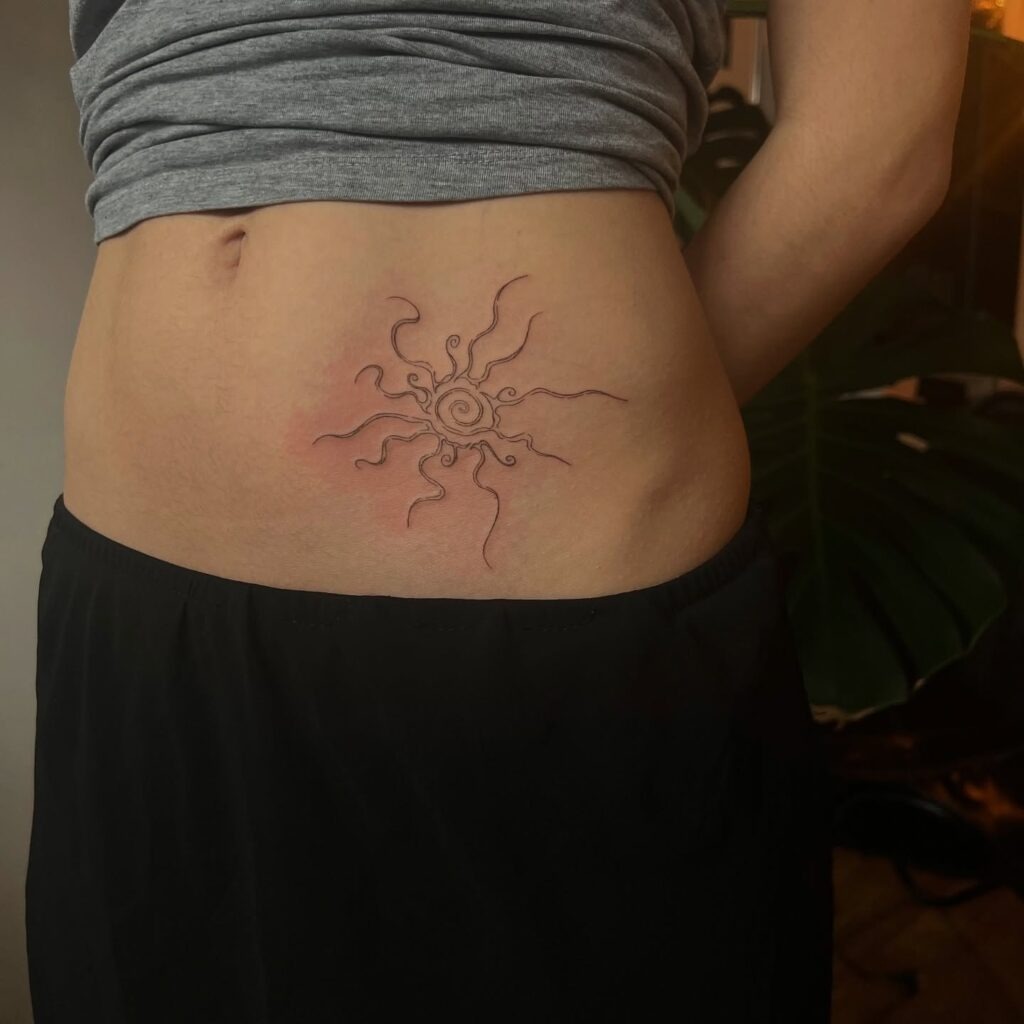 Abstract Black Ink Sun Tattoo on Lower Stomach Tattoo Design