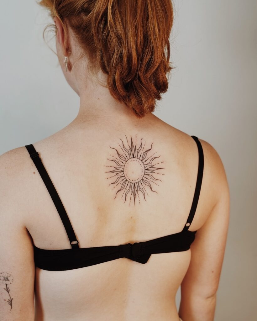 Delicate Dotwork Sun Tattoo on Upper Back Tattoo Design