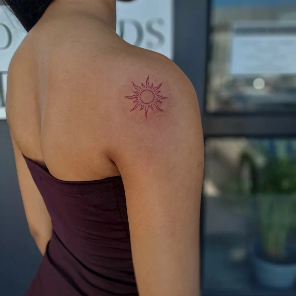 Delicate Red Sun Tattoo on Shoulder Tattoo Design