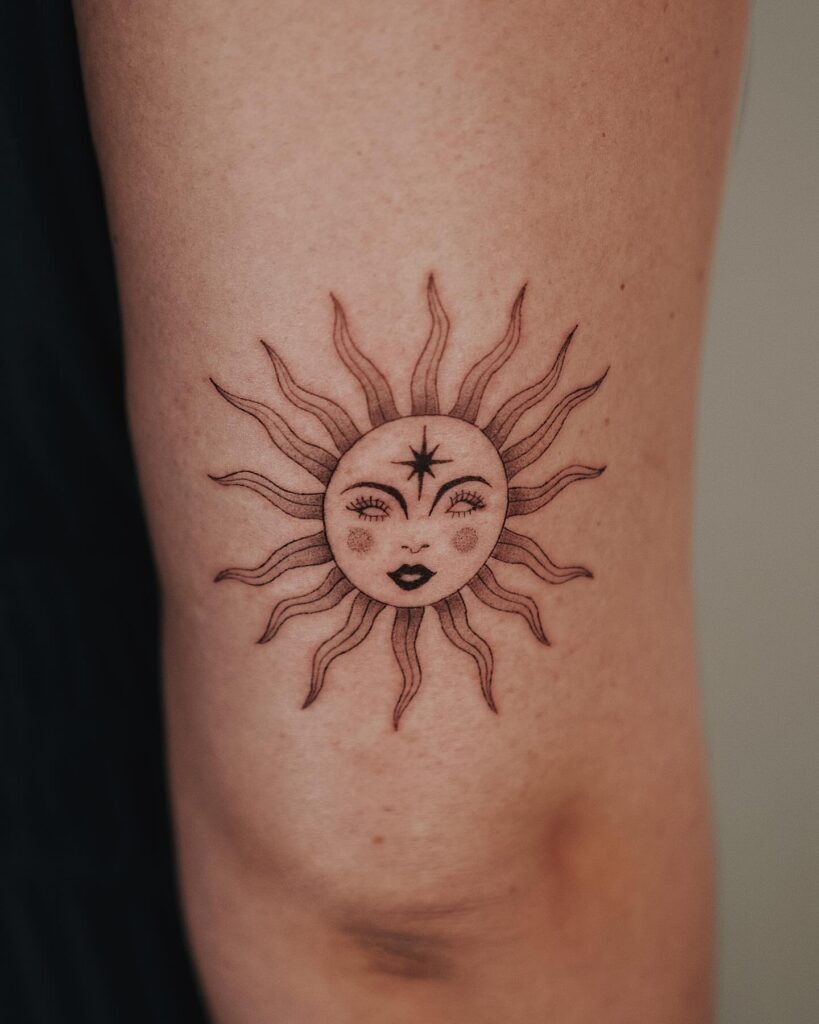 Feminine Sun Face Tattoo with Star Accent Tattoo Design