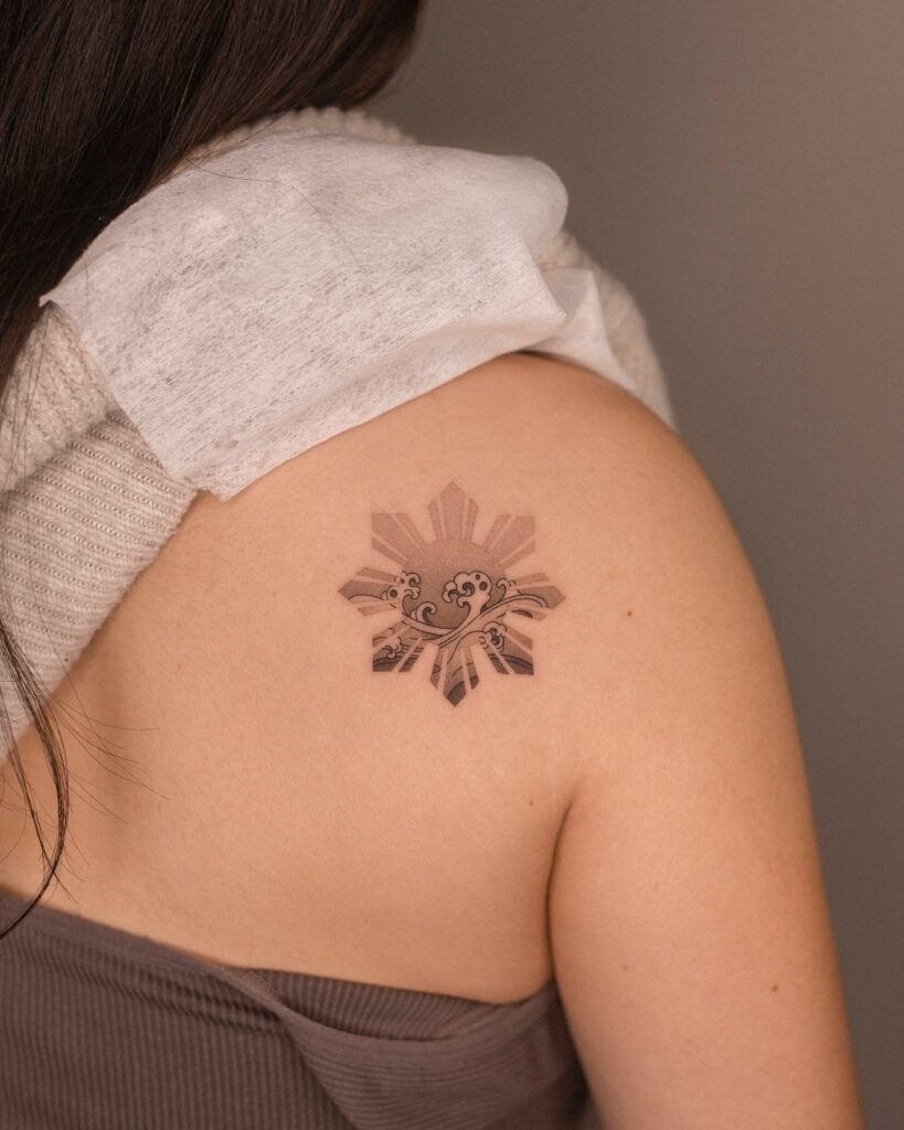 Filipino Sun with Wave Tattoo Tattoo Design