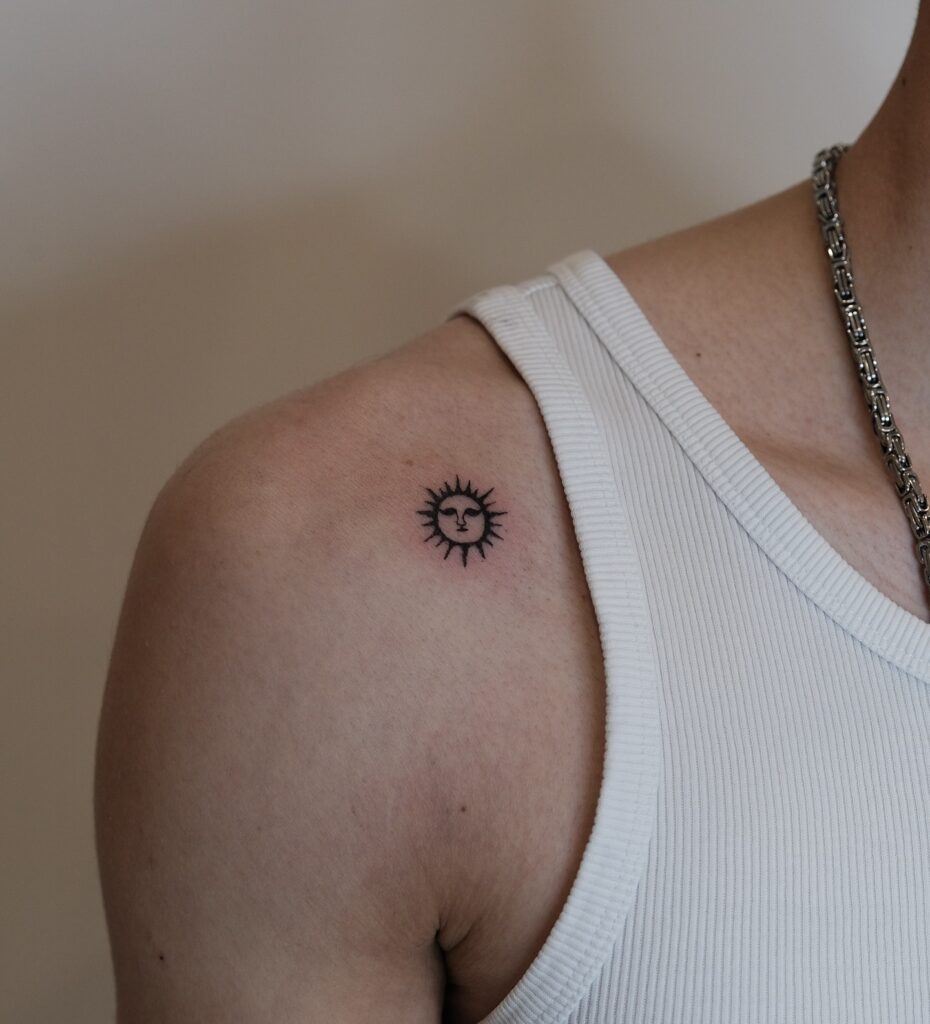 Minimal Sun Face Tattoo on Shoulder Tattoo Design