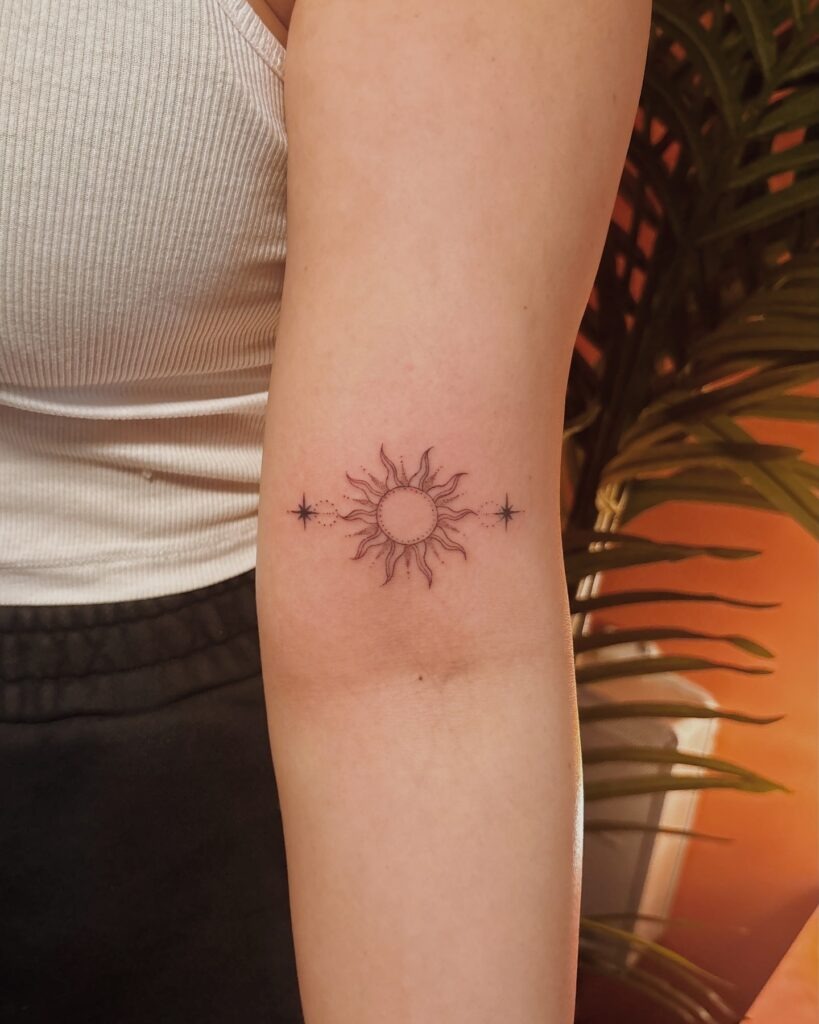Minimalist Sun and Stars Arm Tattoo Tattoo Design