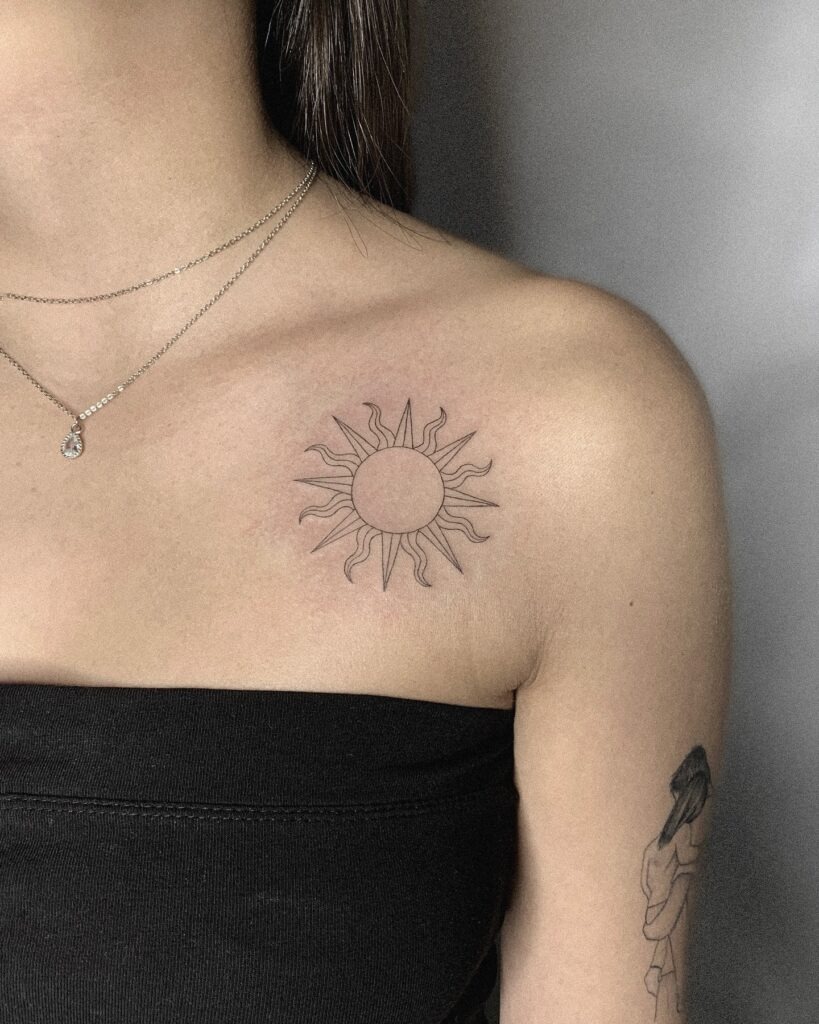 Minimalist Sun Tattoo on Chest Tattoo Design