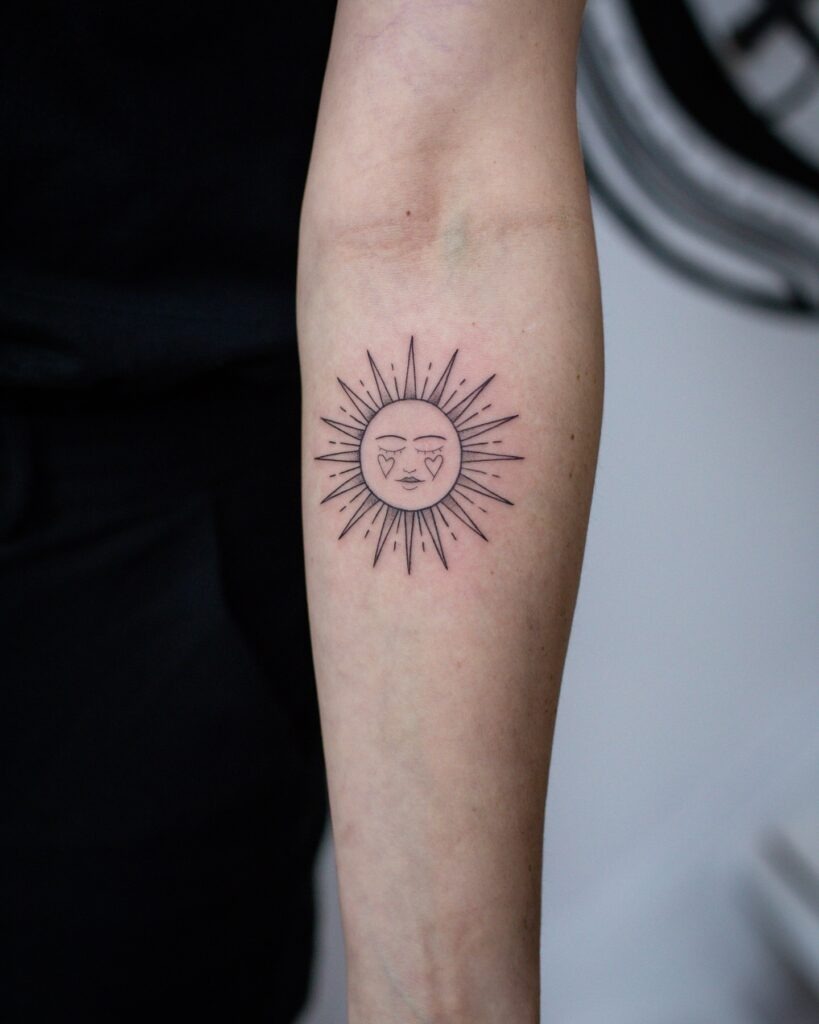 Radiant Sun Face Tattoo with Heart Details Tattoo Design