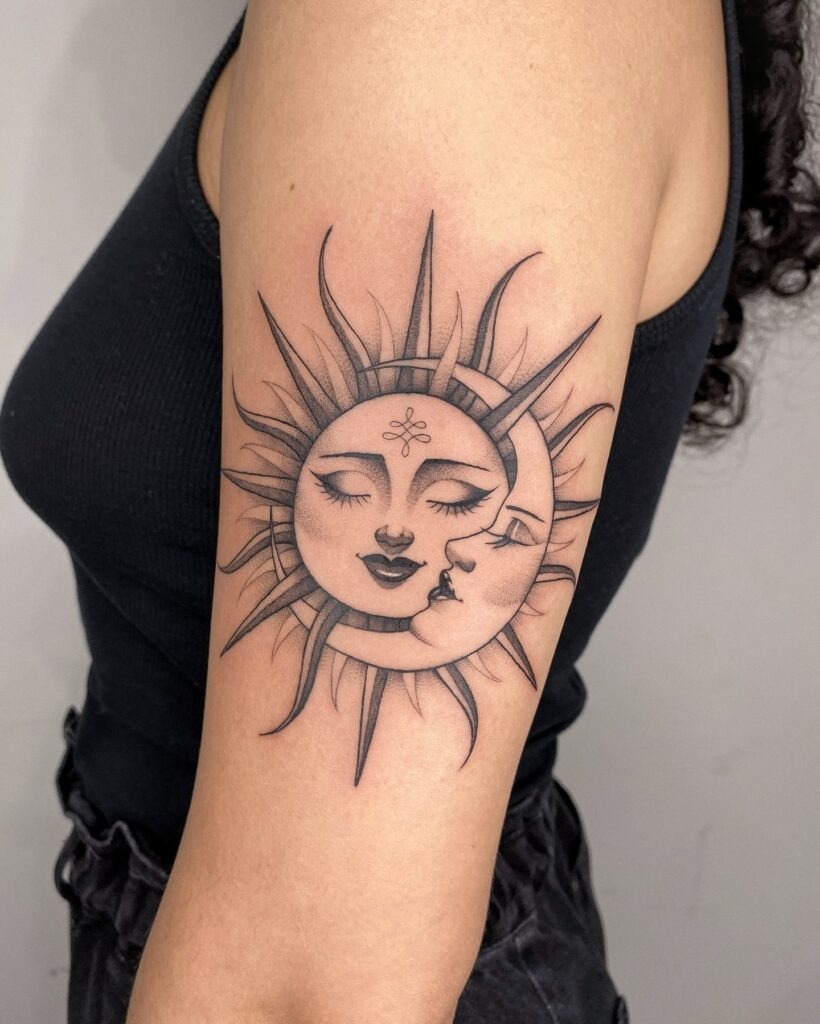 Sun and Moon Face Tattoo on Upper Arm Tattoo Design