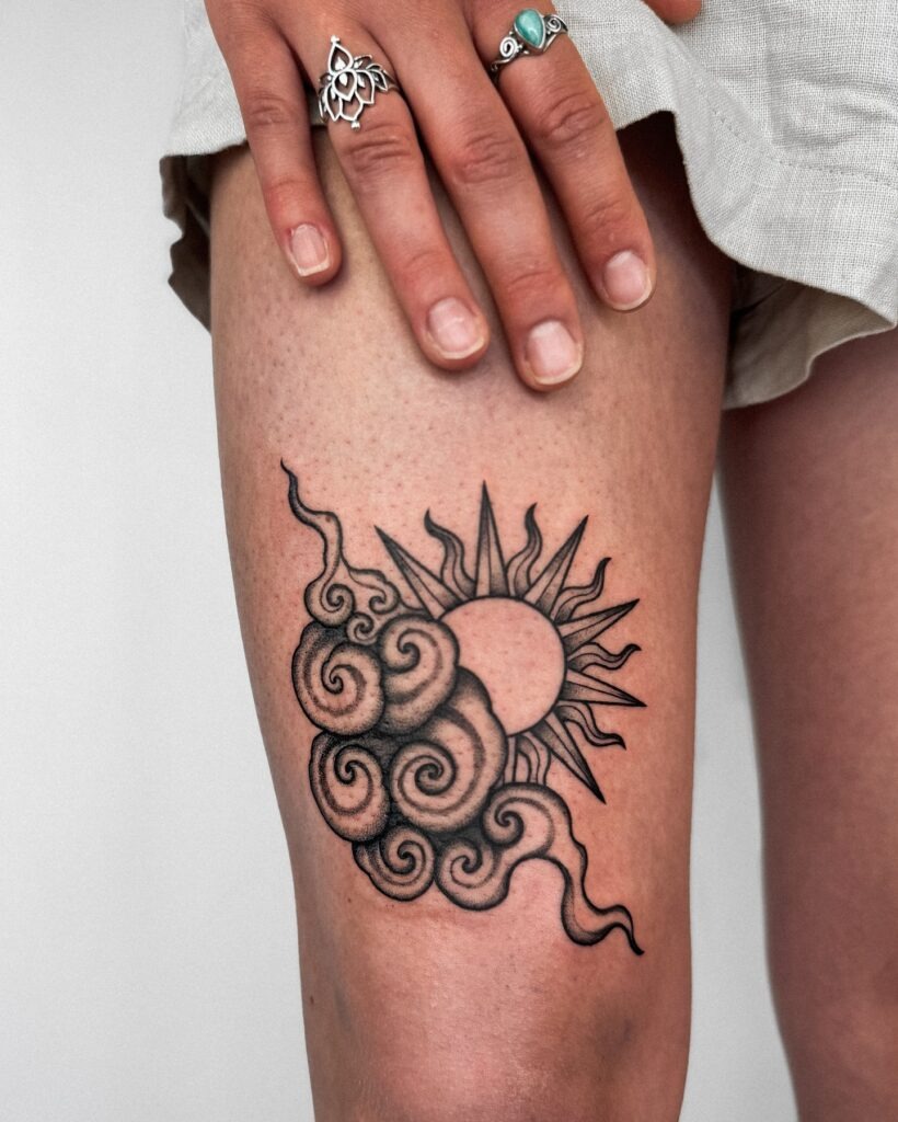 Sun and Swirling Clouds Thigh Tattoo Tattoo Design