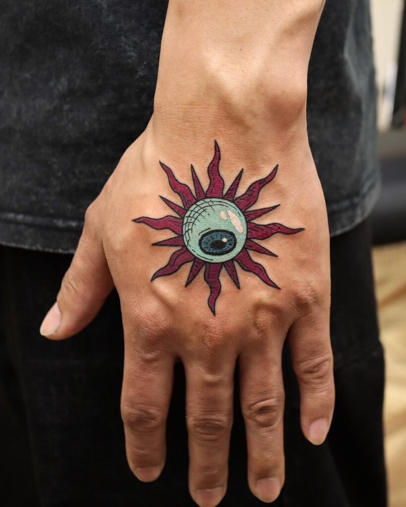 Surreal Sun Eye Tattoo on Hand Tattoo Design