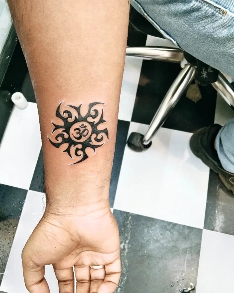 Tribal Sun Tattoo with Om Symbol Tattoo Design
