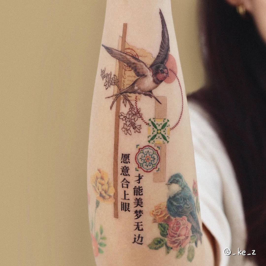 Beautiful swallow tattoo with floral accents Tattoo Design