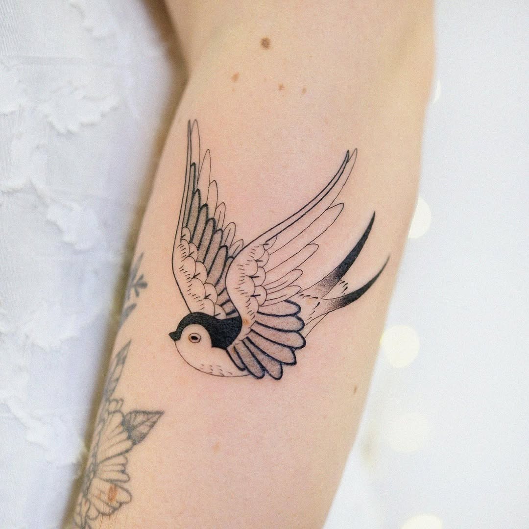 Elegant swallow tattoo in flight Tattoo Design