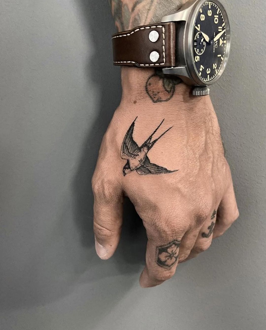 Elegant swallow tattoo on the hand Tattoo Design