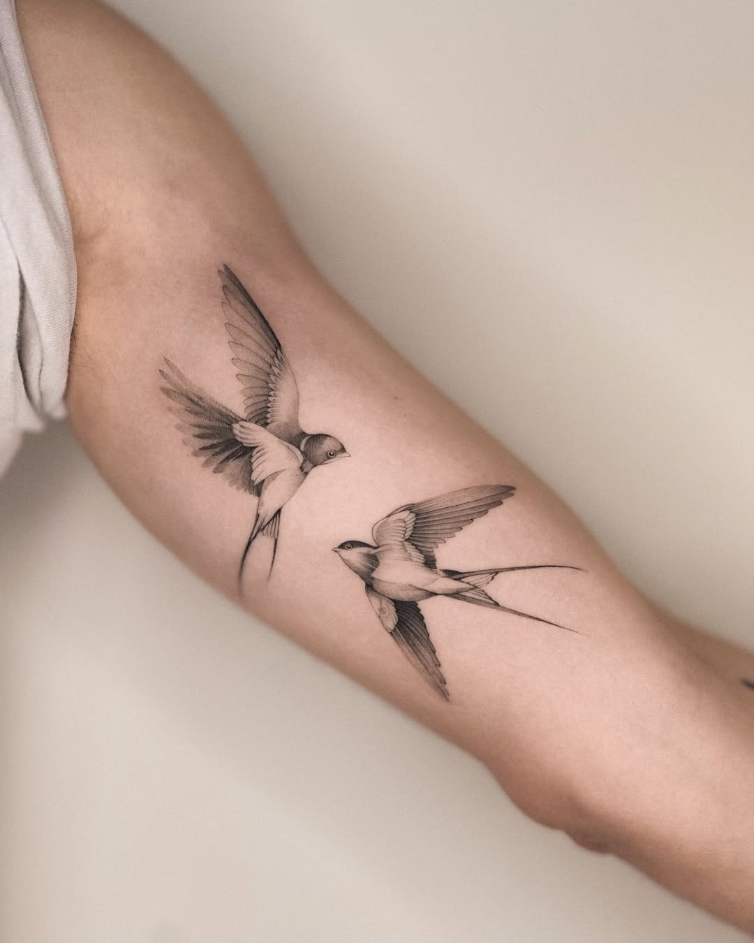 Elegant Swallow Tattoos in Dynamic Flight Tattoo Design