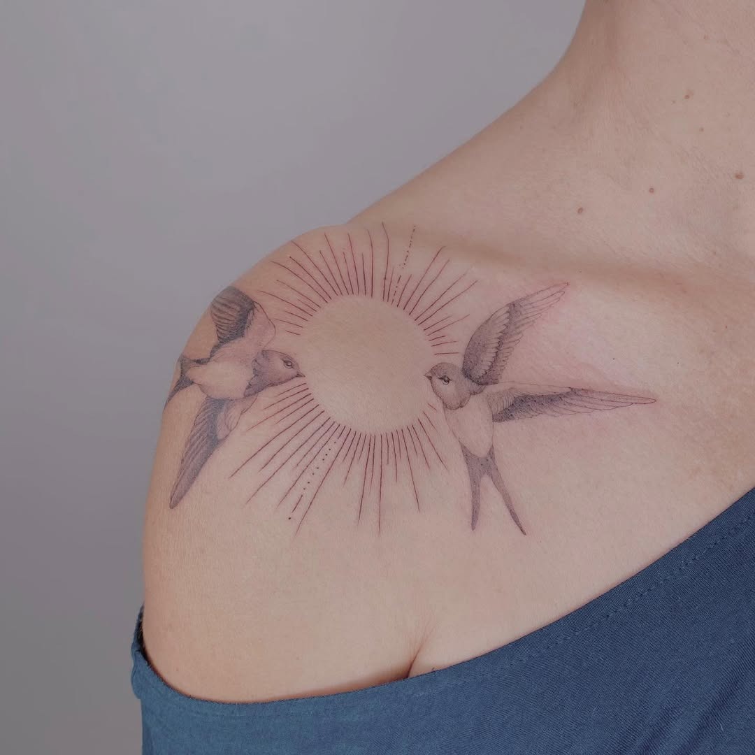 Elegant swallows framed by radiant sun rays Tattoo Design