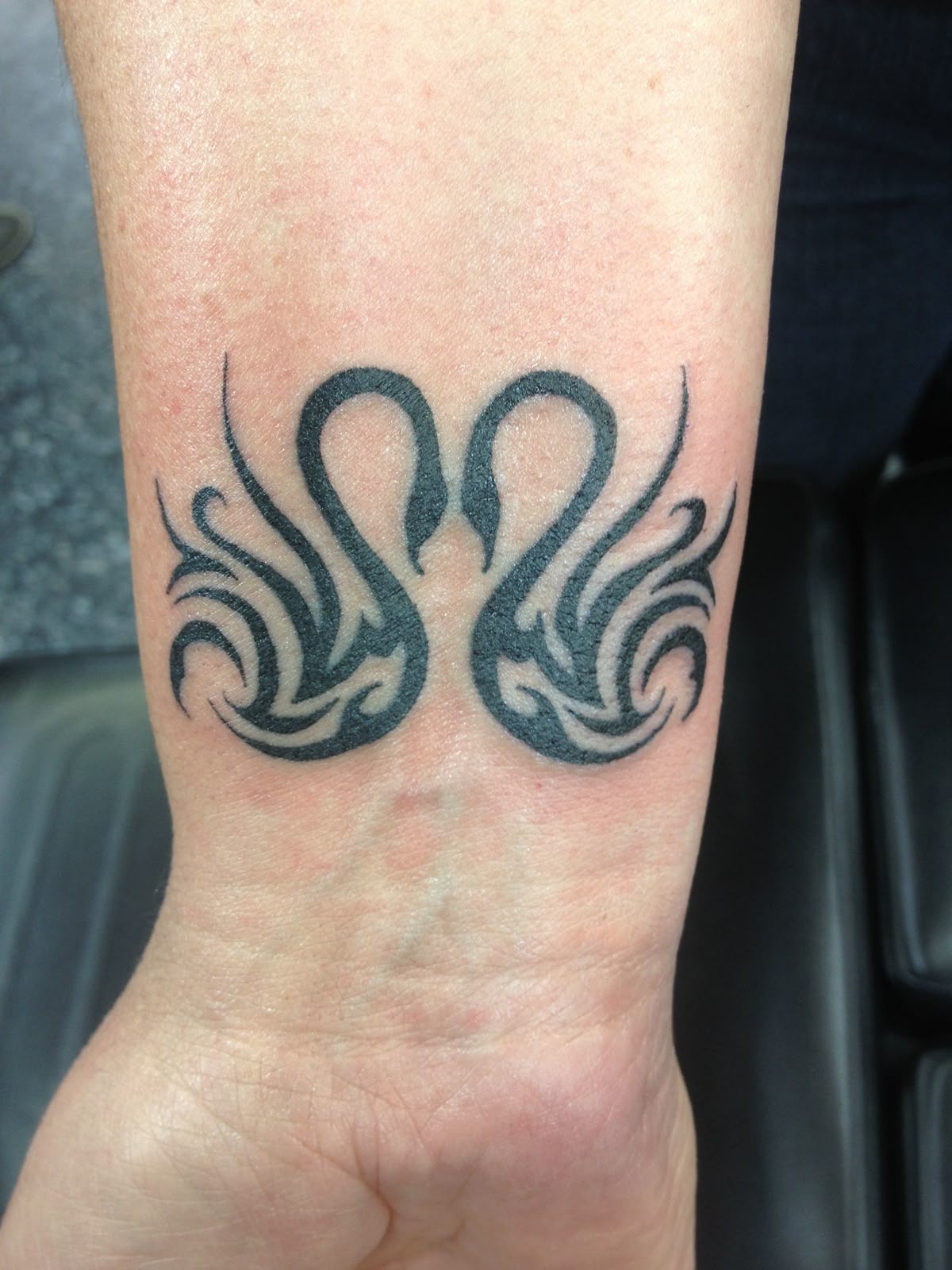 Tribal-Inspired Matching Swan Pair Tattoo Design