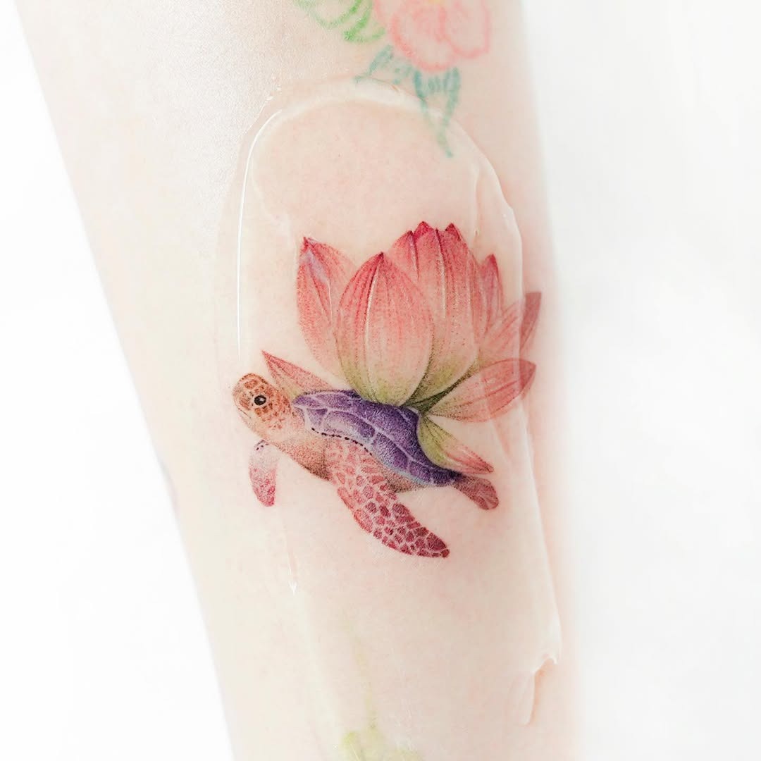 A vibrant sea turtle and lotus fusion tattoo Tattoo Design
