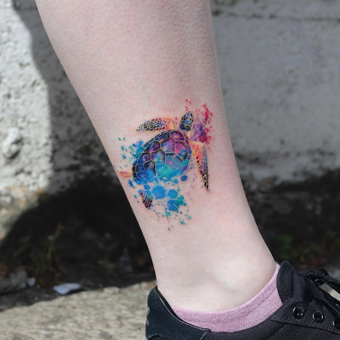 Colorful sea turtle tattoo with splash effects Tattoo Design