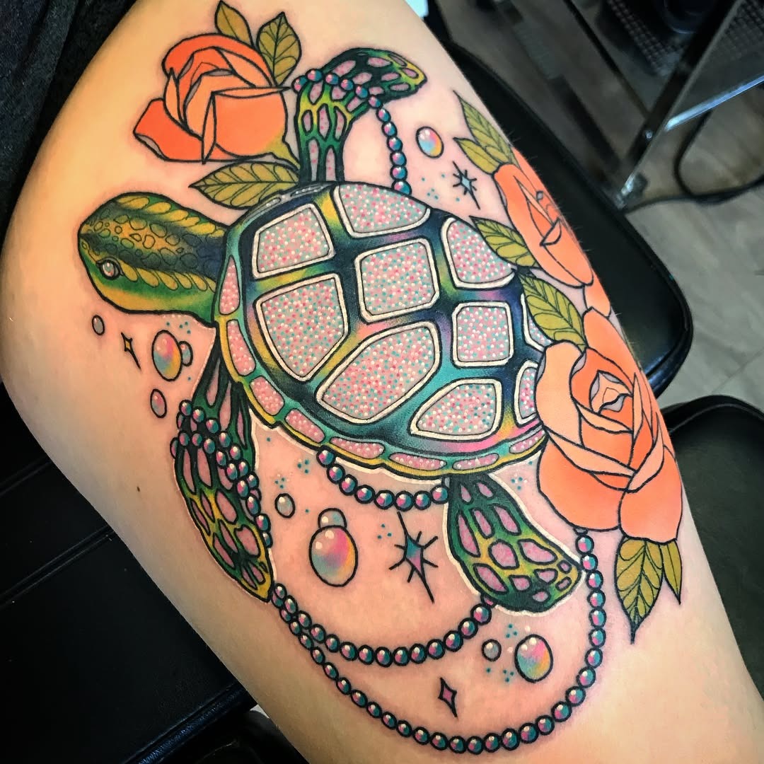 Colorful turtle tattoo with floral accents Tattoo Design