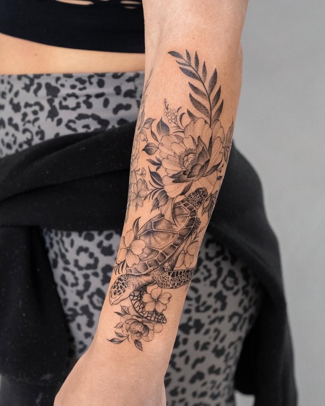 Elegant floral turtle tattoo on the forearm Tattoo Design
