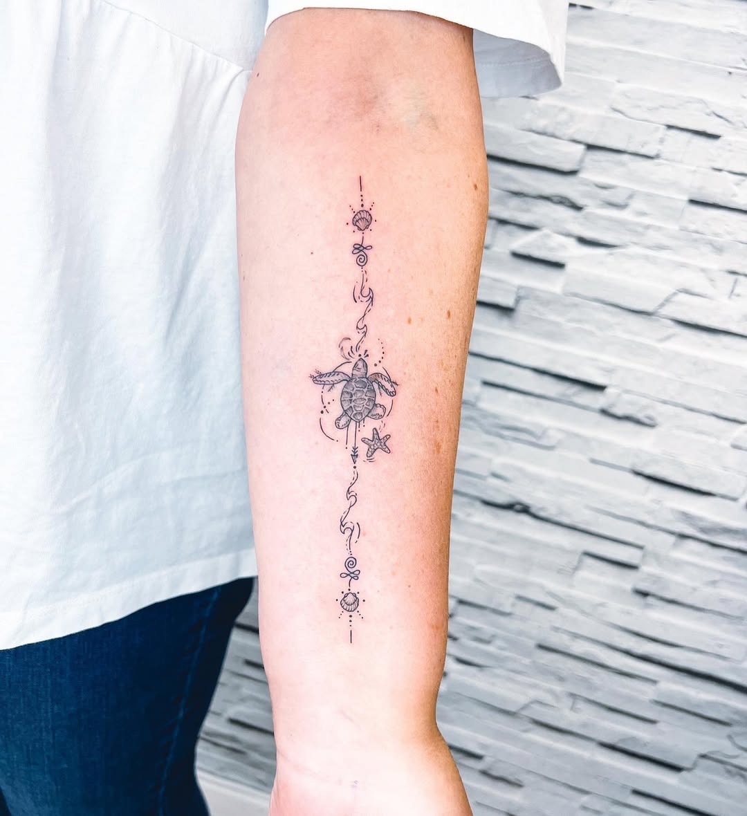Minimalist turtle tattoo with ocean elements Tattoo Design