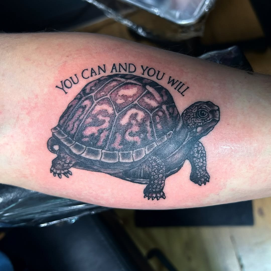 Realistic turtle tattoo with motivational message Tattoo Design