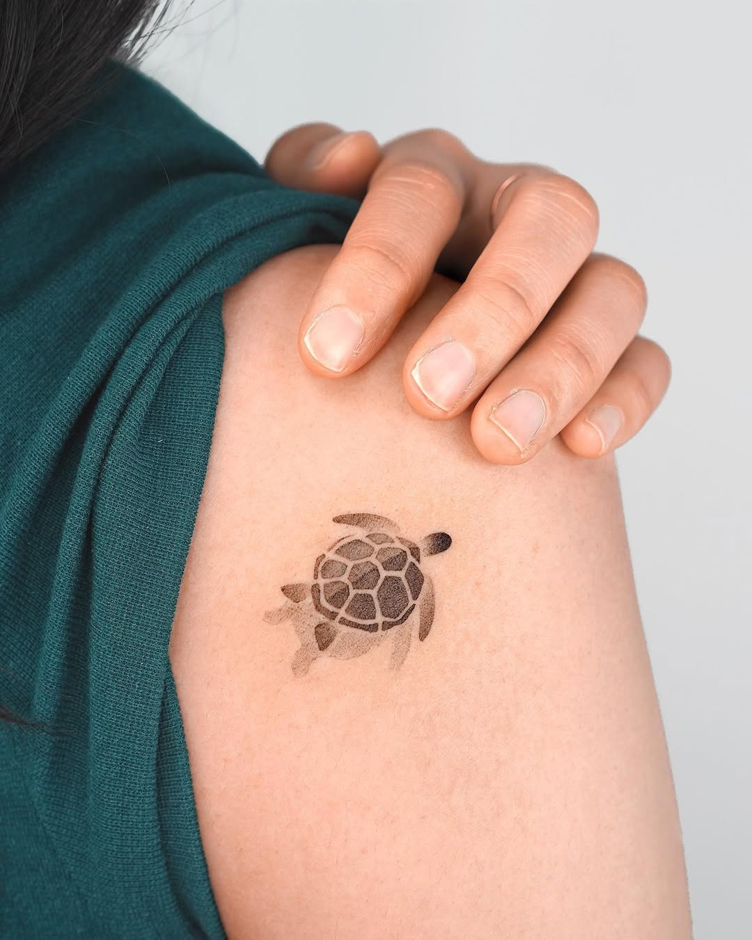 Stylish minimalist turtle tattoo on shoulder Tattoo Design