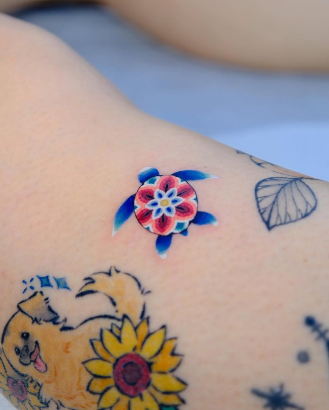 Vibrant sea turtle tattoo with floral design Tattoo Design