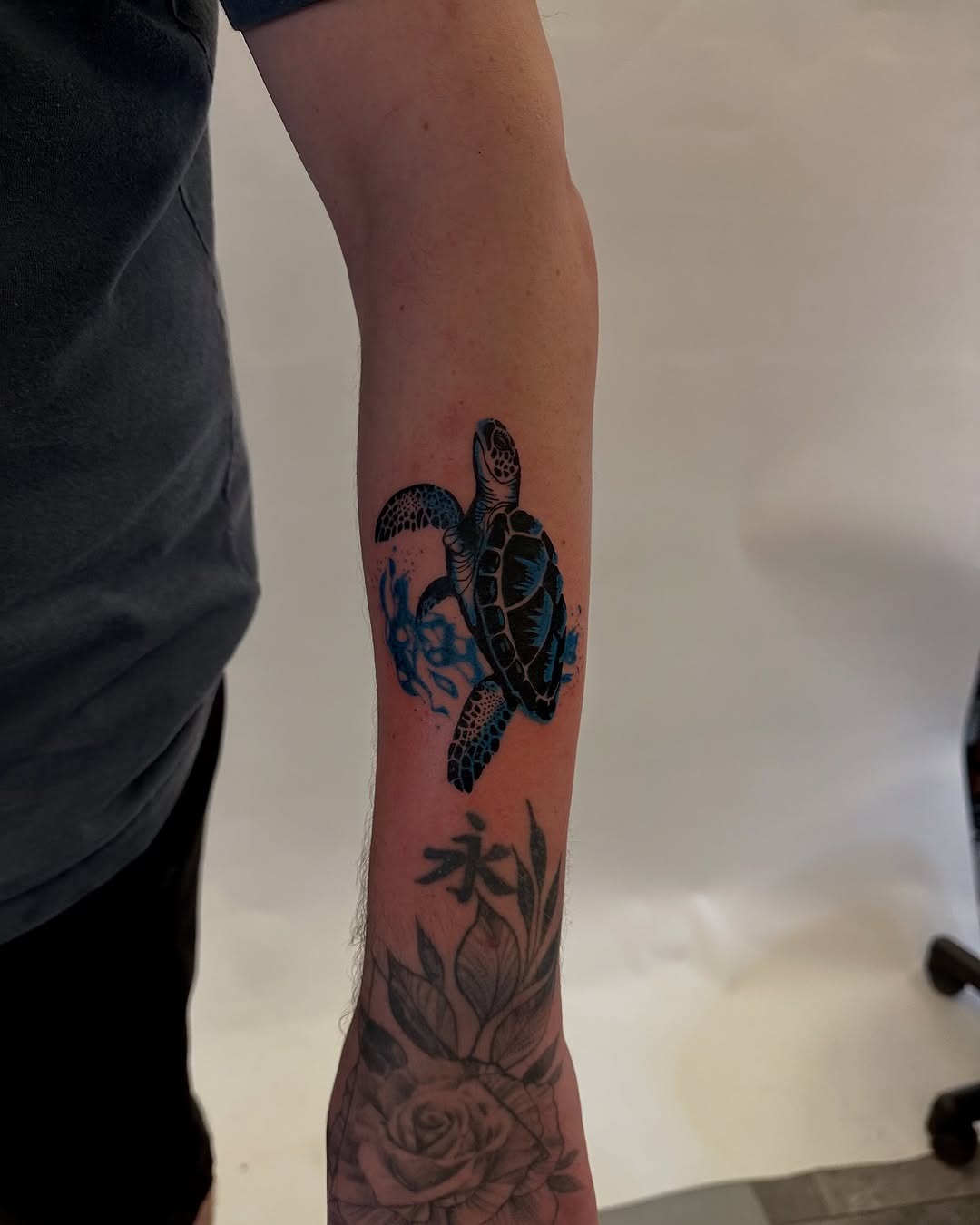 Vibrant turtle tattoo with blue ocean waves Tattoo Design