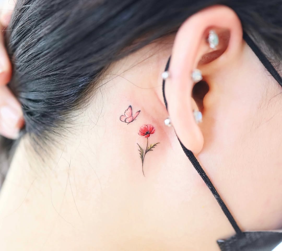 Delicate watercolor butterfly and flower tattoo Tattoo Design