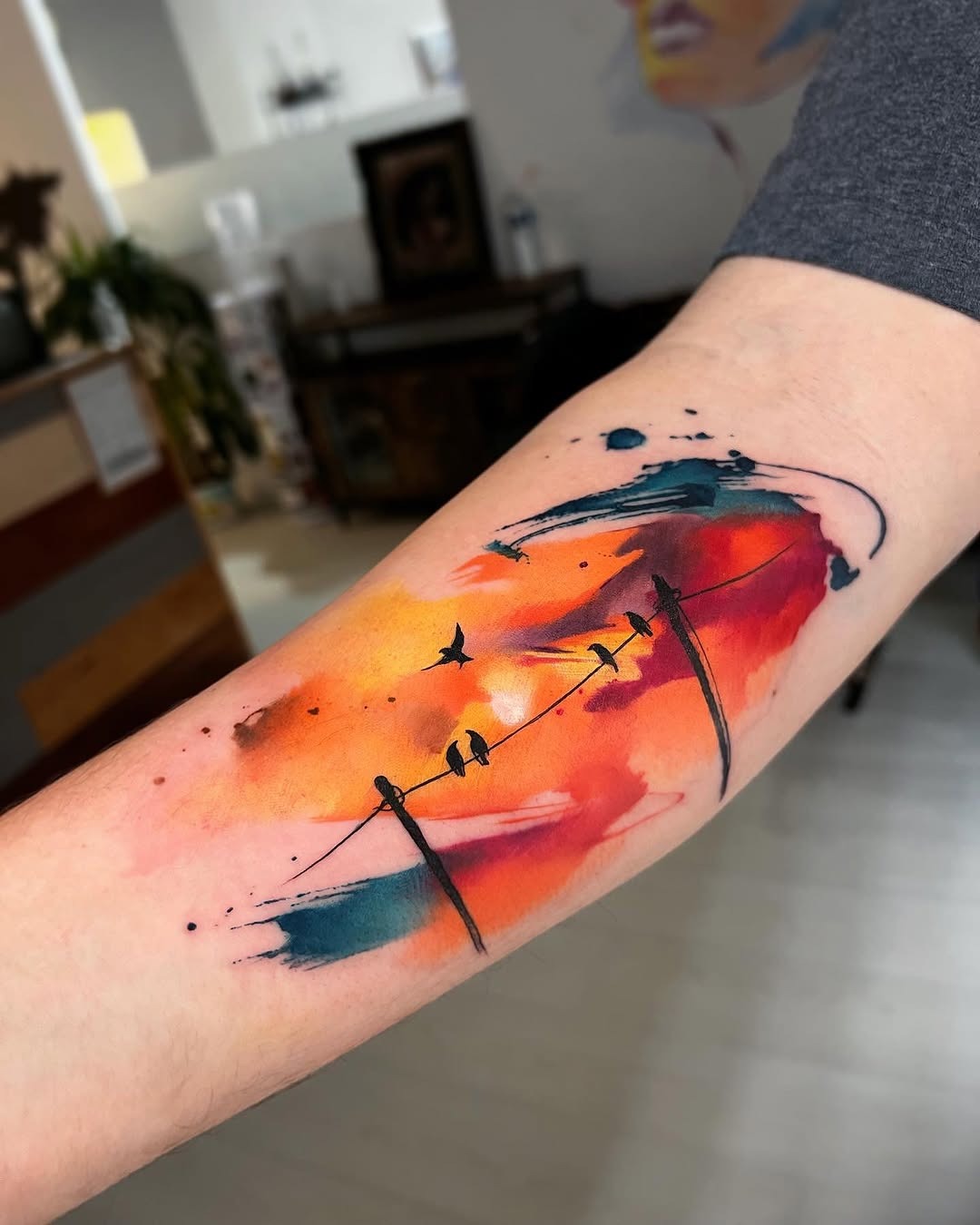 Dynamic sunset-inspired watercolor bird tattoo Tattoo Design