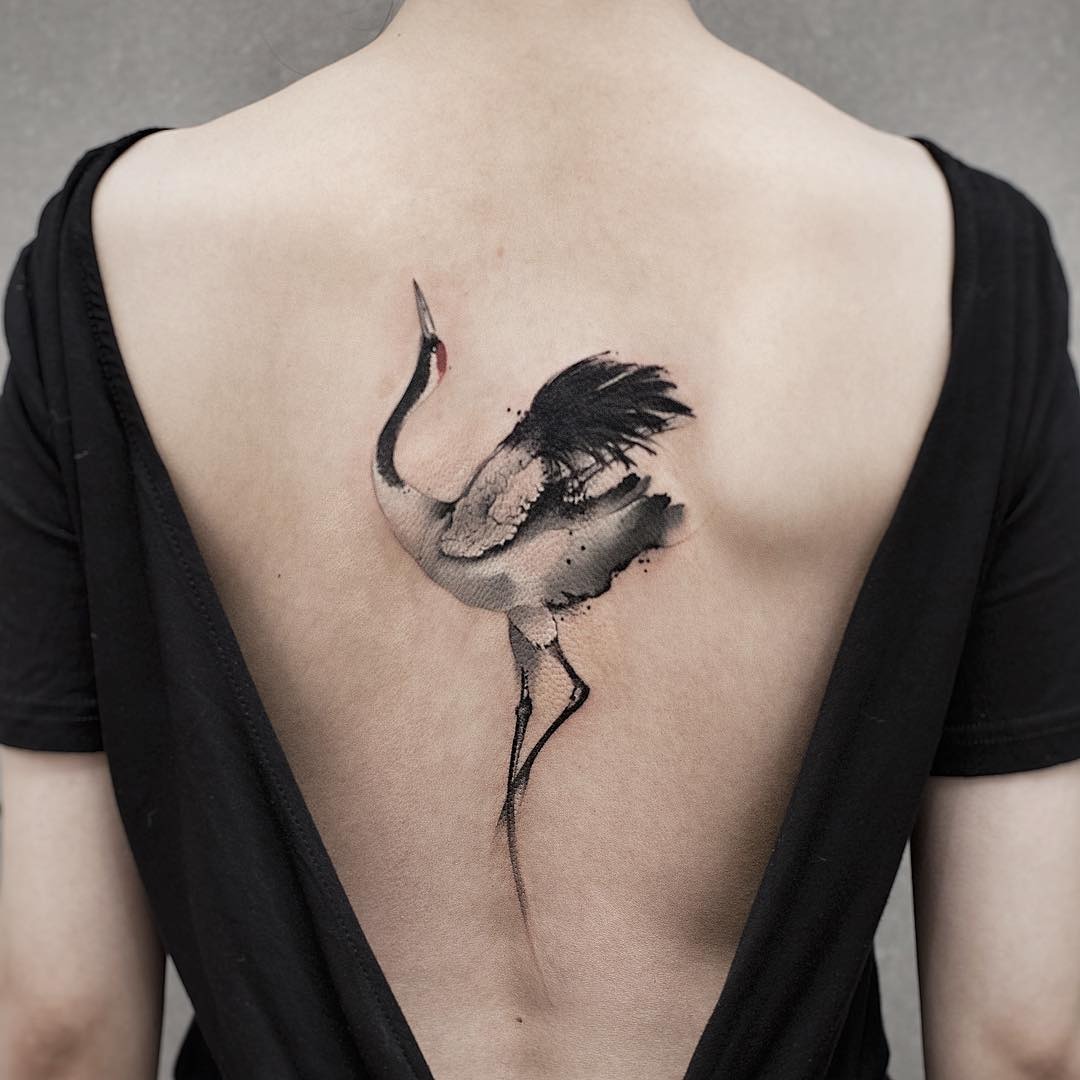 Elegant crane watercolor tattoo on the back Tattoo Design