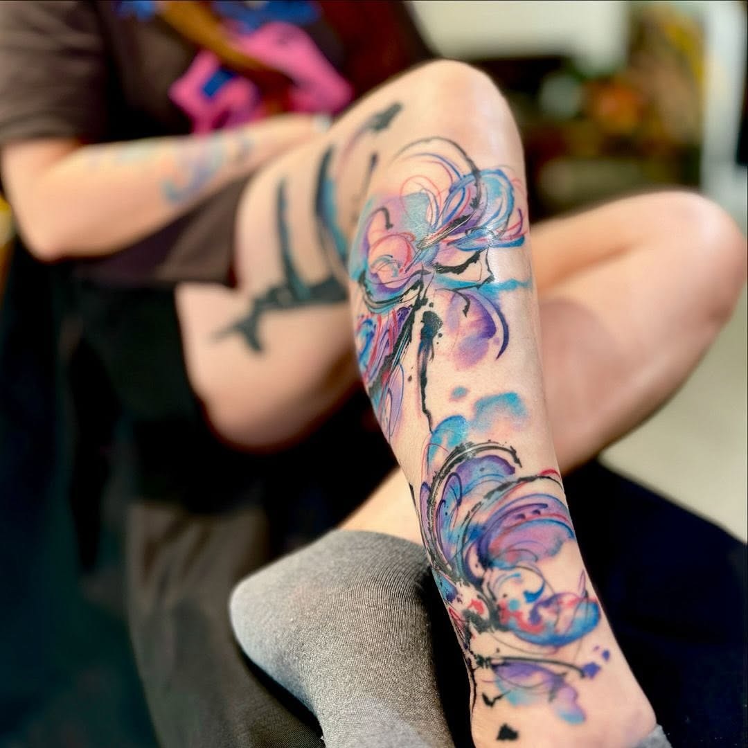 Elegant floral watercolor tattoo on leg Tattoo Design
