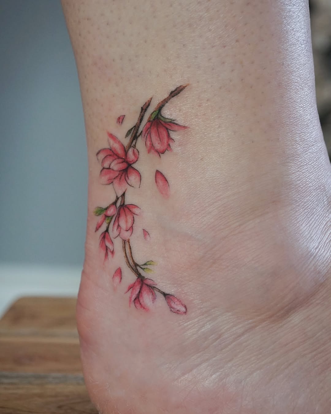 Elegant watercolor floral ankle tattoo design Tattoo Design