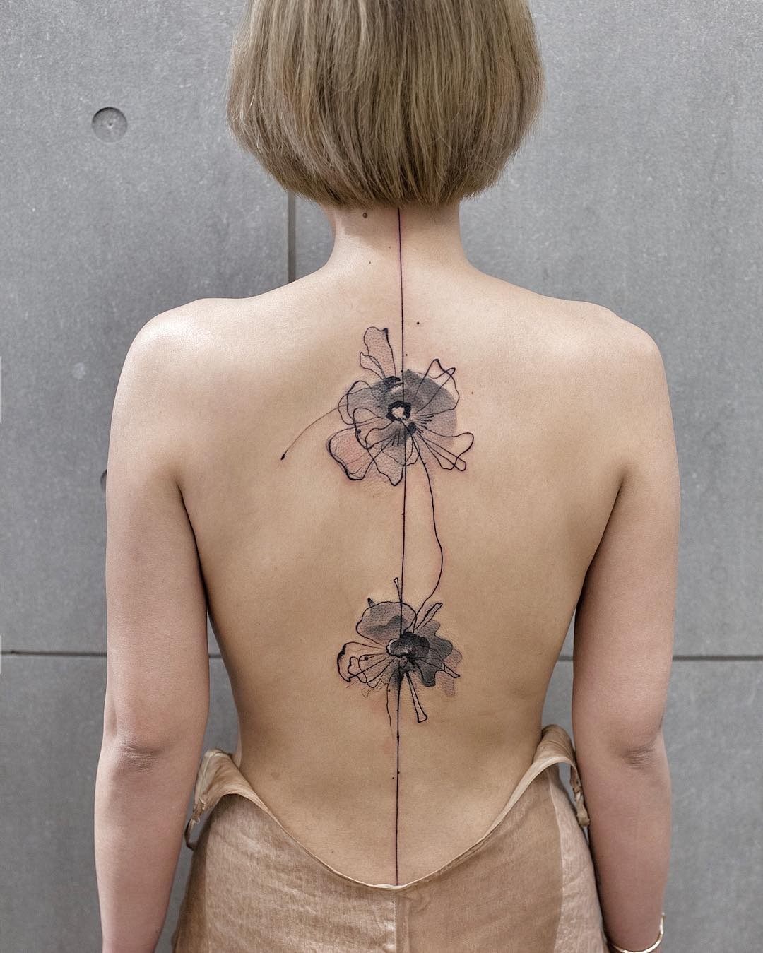 Stunning Watercolor Floral Tattoo on Back Tattoo Design