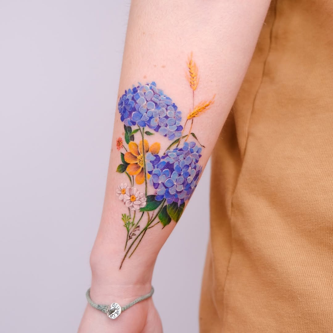 Stunning watercolor floral tattoo on the arm Tattoo Design